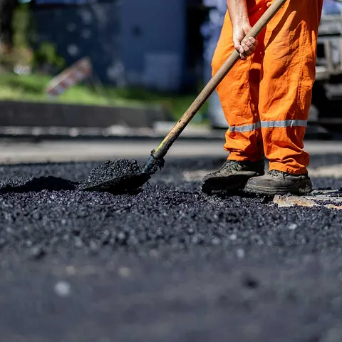 Expert fixing a road