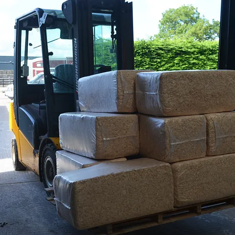 Moving animal bedding with a forklift