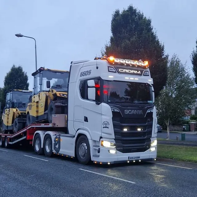 Lorry hauling plant machinery 