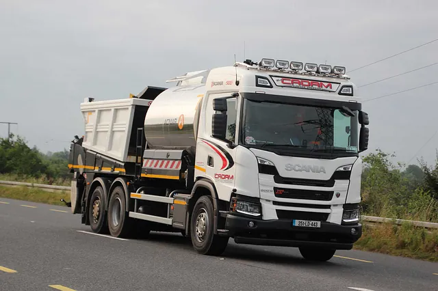 Larry driving on road