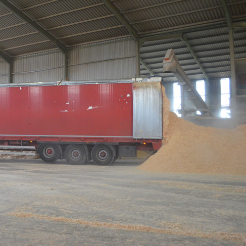 Lorry dumping sand from a trailer